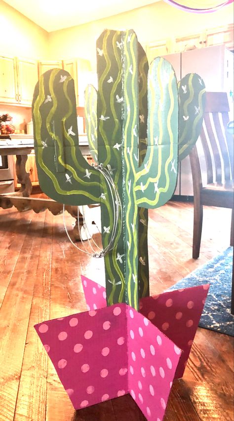 Cardboard cutouts, one cut halfway up, one halfway down, and slid together to make it 4D. #ringtoss #cactus #birthdayparty #birthdaygames #tacotwosday #fiesta #diygames Cactus Ring Toss, Cowboy Vbs, Cardboard Cactus, Southwest Party, Monumental Vbs, Cactus Classroom, Homecoming 2024, Cactus Ring, Texas Tea