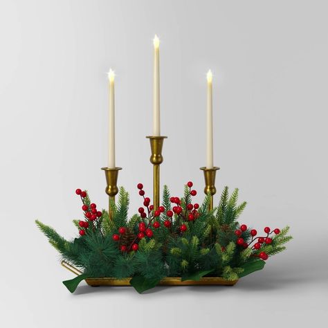 Create a delightful holiday setting with the 3-Piece Christmas Flameless Taper Candle and Gold Holder in Wood Tray with Faux Greenery from Wondershop™. This three-piece taper candle decoration showcases candles surrounded by faux red berries and pine greenery, all in a gold-tone tray for a festive vibe. The flameless taper candle centerpiece requires two AA batteries for casting a warm glow. Welcome to the Wondershop™. Taper Candle Centerpiece, Gold Candle Holder, Flameless Taper Candles, Red Tablecloth, Faux Christmas, Gold Candle, Gold Candle Holders, Faux Greenery, Metal Tray