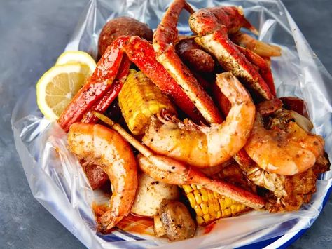 Seafood Boil in a Bag Recipe Seafood Boil In A Bag, Seasoned Butter, Seafood Boil Recipes, Seafood Bake, 5 Ingredient Dinners, Boiled Food, Crab Boil, Shrimp Seasoning, Seafood Boil