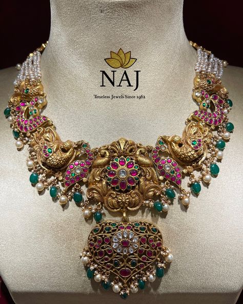 Bridal Collection - Traditionally designed Haram in deep nakshi work adorned with polkies, rubies, emeralds and pearls…Only @ NAJ #naj #myfavouritenaj #ournaj #newandhrajewellery #najjewellery #goldjewellery #templejewellery #antiquejewellery #southindianjewellery #southindianweddings #southjewellery #silverjewellery #silverarticles #antiquesilver Naj Jewellery, Nakshi Jewellery, Antique Necklaces Design, Antique Gold Jewelry Indian, Antique Necklaces, Indian Bridal Jewelry Sets, Antique Bridal Jewelry, Antique Gold Jewelry, South Indian Jewellery