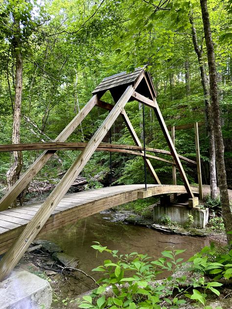 May 26, 2023 Small Bridge Over Creek, Yard Bridge, Stone House Revival, Garden Bridge Design, Backyard Bridges, Outdoor Bridges, Outdoor Improvements, Wood Walkway, Framing Construction