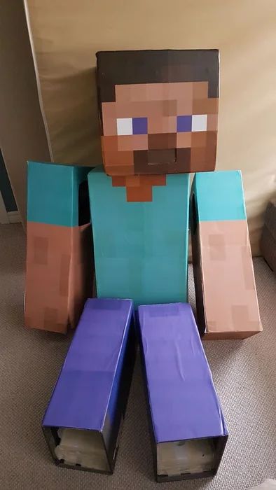 Minecraft Steve Cardboard Box Costume DIY: 12 Steps Steve From Minecraft Costume Diy, Steve Costume Minecraft, Diy Steve Minecraft Costume, Minecraft Diy Costume, Diy Minecraft Box Characters, Minecraft Cardboard Diy, Minecraft Costumes Diy, Minecraft Boxes Diy, Minecraft Costume Diy