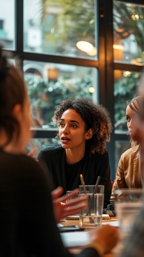 Engaged Conversation Indoors: A young woman engaged in a deep and thoughtful conversation with her friends at a cozy cafe. #woman #cafe #conversation #friends #table #aiart #aiphoto #stockcake ⬇️ Download and 📝 Prompt 👉 https://ayr.app/l/qJ3T Coffee People Photography, Black Woman Drinking Tea, People At Coffee Shop, Cafe Conversation, Woman In Coffee Shop, Comic Poses, Friends Table, Deep Conversation, Brunch With Friends