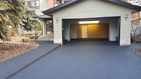 Don’t tear out your old concrete - repave with rubber — RenovationFind Blog Rubber Driveway Recycled Tires, Resurface Concrete Driveway, Recycled Rubber Pavers, Repair Concrete Driveway, Rubber Driveway, Concrete Driveway Resurfacing, Rubber Pavers, Driveway Resurfacing, Concrete Paving Slabs