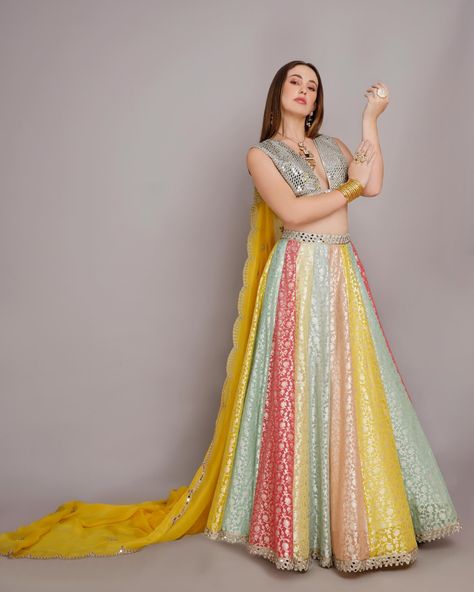 Elevate your ethnic wardrobe with our exquisite multicoloured lehenga adorned with a dazzling mirror blouse. Inspired by traditional craftsmanship and contemporary design. This ensemble promises to make a statement at any occasion. Model @roberta.cardoso30 Jewellery@suhana_art_and_jewels Photography @7vik_studio #harshi#harshidesigns#multicoloredlehenga#instapi c#mirrorblouse#occassionwear#weddingoutfit#india nwedding#haveharshihavebeauty Multicoloured Lehenga, Mirror Blouse, Lehenga, Contemporary Design, India, Mirror, Wardrobe, Makeup, Photography