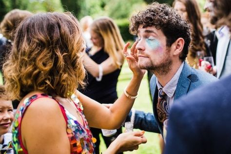 Why Every Wedding Needs To Have a Glitter Station Face Painting Station Wedding, Wedding Face Painting, Wedding Glitter Station, Glitter Station Wedding, Wedding Face Paint, Glitter Station, Glitter Face Paint, Glitter Beards, Glitter Bar