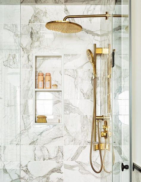 Brass gives fixtures like a generous rainhead shower and handheld spray a classic, historic look. The bonus? The finish warms up materials like porcelain (shown here) and marble. | Photographer: Gillian Jackson and Lauren Miller | Designer: Miriam Aboutaam Rainhead Shower, Master Bath Suite, Shower Remodel Diy, Sophisticated Bathroom, Bathroom Trends, Corner Shower, Shower Remodel, Marble Bathroom, Marble Tile