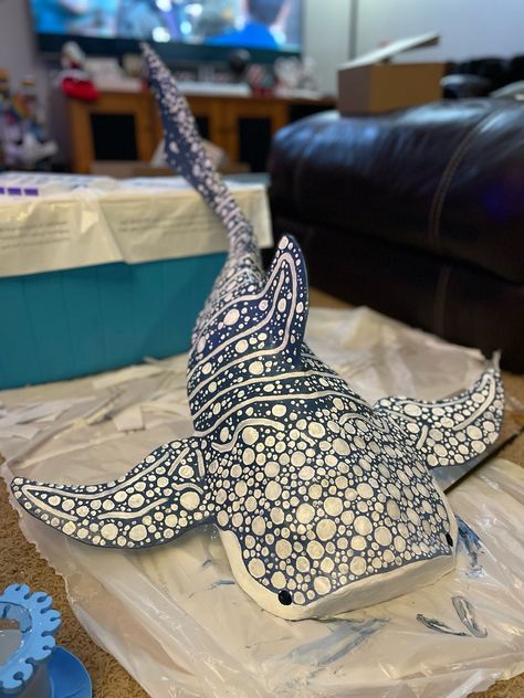 This was right after i finished painting it <3 I’ll probably post the work in progress photos later Paper Mache Sea Creatures Art Projects, Stingray Paper Mache, Wall Shark Cardboard, Cardboard Whale Shark Template, Diy Whale Shark, Diy Room Decor Ocean Theme, Paper Mache Manta Ray, Card Board Shark, Paper Mache Stingray