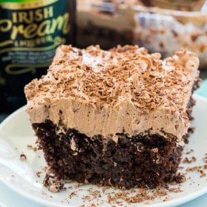 Irish Cream Poke Cake - Spicy Southern Kitchen Irish Cream Poke Cake, Desserts Potluck, Irish Cream Frosting, Cream Poke Cake, Irish Cream Cake, Spicy Southern Kitchen, Flavored Whipped Cream, Poke Cake Recipe, Cake Mix Ingredients