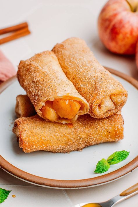 These vegan apple pie egg rolls are filled with soft, gooey apple chunks and coated with a crispy cinnamon sugar topping! Pink Lady Apple Pie, Pink Lady Apple Desserts, Pink Lady Apple Recipes, Pink Lady Apples Recipes, Apple Pie Egg Rolls, Apple Roll, Fried Apple Pies, Homemade Egg Rolls, Food Deserts