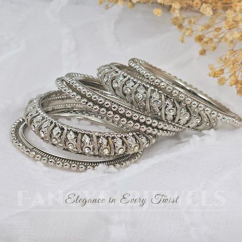 Adorn your wrists with this stunning silver polki bangle set.💫✨️ . . . . . . . . . #jewellery #silverbangles #bridaljewellery #jewellerytrends #pakistanijewellery #jewellerygifts #indianjewelleryuk #nacklaces #earrings #jewelry #bangleset #jhumkas #bangles #mathapatti #jutti #clutchbags #potlibagsforweddings #anklets #jhanjar #tikkaset #jewelleryoftheday #polkijewellery #mangtikka❤️ #jhumkabangles #goldbangles Indian Bangles Set, Indian Bangles, Bangles Set, Bangles Indian, Polki Jewellery, Authentic Indian, Diamond Bangle, Bangle Set, Indian Jewellery