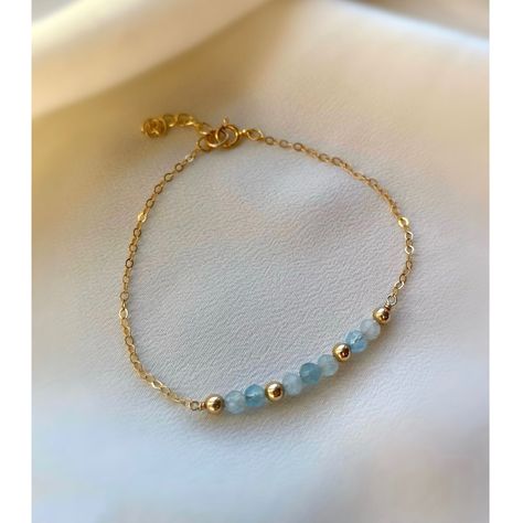 **DESCRIPTION** Delicate gold filled bracelet with micro-faceted sparkly aquamarine beads. Individually selected high quality gemstones make the bracelet truly special and one of a kind. The delicate and minimalist design goes well with both casual and sophisticated looks. Wear it by itself or stacked up with other minimalist bracelets available at the shop. **MATERIALS** - 14kt gold filled chain, 14kt gold filled clasp and chain extender (1 inch) - Aquamarine beads (approx. 3mm) **PACKAGING** A Gemstone Bracelet Designs, Bead And Chain Bracelet, Crystal Bead Bracelet Ideas, Bracelet Packaging Ideas, Crystal Bracelet Ideas, Minimalist Bracelets, Gold Minimalist Jewelry, Bracelet Packaging, Aquamarine Bracelet