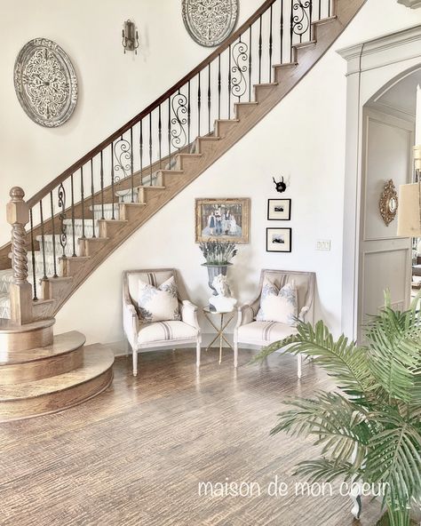 Curved staircase, curved wall  maison de mon coeur. French country French Country Foyer Design, Pictures On Curved Staircase Wall, Decorate Curved Staircase Wall, Curved Stairs Decor, Entryway With Curved Staircase, French Country Staircase Railing, French Farmhouse Staircase, French Style Staircase, Decorate Curved Wall