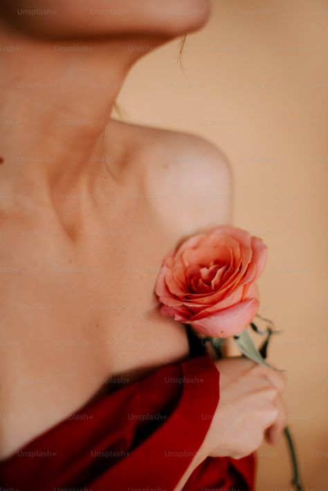 A woman in a red dress holding a rose photo – Posing Image on Unsplash Holding A Rose, Diy Anniversary Gift, Photo Posing, Neck Flower, Drying Roses, Photo Lens, Diy Anniversary, Rose Photo, Tan Background