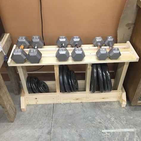 For a simple to build design that can hold both dumbbells and weight plates, consider this DIY design.The rack was created using only 2x6s, scrap plywood and screws. It's a simple way to keep your weights organized without breaking the bank. Exercise Organization, Diy Weight Rack, Diy Dumbbell Rack, Weights Rack, Garage Organization Cheap, Diy Dumbbell, Home Gym Basement, Diy Gym Equipment, Diy Rack