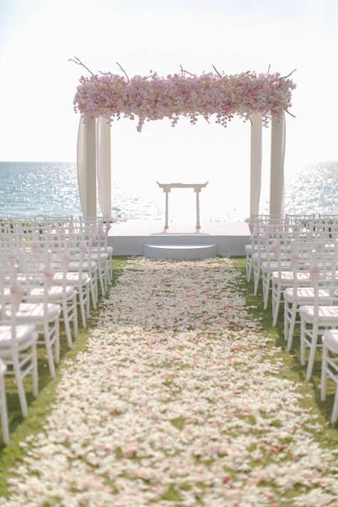 This petals roses path shows the way to the arch of the wedding ceremony and to the sea view. The flowers arrangement on the arch bring us to a romantic mood accompanied by perfect weathers conditions..! #romantic #weddingceremony #wedding #event #planners #Phuket #Thailand #flowers #villa #venue #beachwedding #flowerspath #seaview Sea View Wedding Ceremony, Flower Path Wedding, Thailand Flowers, Wedding Walkway, Thailand Phuket, British Wedding, Wedding Photography Gallery, March Wedding, Thailand Wedding