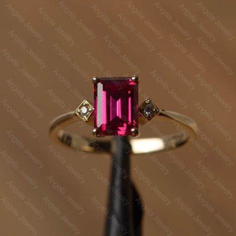 It is a lab ruby ring. The main stone is 6mm*8mm emerald cut lab ruby, weight about 1.68 carats. The basic metal is 14k gold. You can also go to my shop Home for more elegant rings:  https://www.etsy.com/shop/godjewelry?ref=hdr_shop_menu Ruby is the birthstone of July, it will be a great gift for your lover! More ruby rings: https://www.etsy.com/shop/godjewelry?ref=listing-shop2-all-items-count&section_id=20709238 Customization is always welcome and please feel free to contact with me if you hav Red Emerald Cut Birthstone Ring, Emerald Cut Red Birthstone Ring, Emerald Cut Ruby Ring In 14k Gold, Emerald Cut Ruby Ring In Yellow Gold, Emerald Cut Red Birthstone Ring In 14k Gold, Ruby Jewelry Ring, Ruby Ring Designs, Blue Sapphire Wedding Ring, Silver Ruby Ring