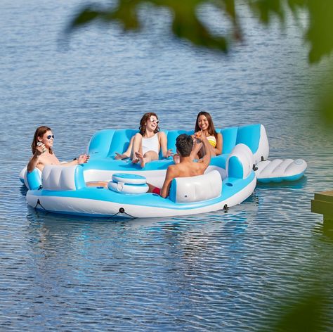 This inflatable water raft features a built-in cooler to keep drinks on hand for everyone, six cup holders, four oversized backrests and a deck area where riders can lay out to get some sun. If you're still feeling hot, hop into the water and hold onto the boarding platform's grab handles to bob alongside. Included is an anchor bag and a repair patch kit in case you hit some rough seas. Weight Capacity: 1320 lbs Lake Rafts, Island Pool, 6 Friends, Raft Boat, Inflatable Island, Inflatable Float, Pool Lounger, Island Lake, Inflatable Kayak