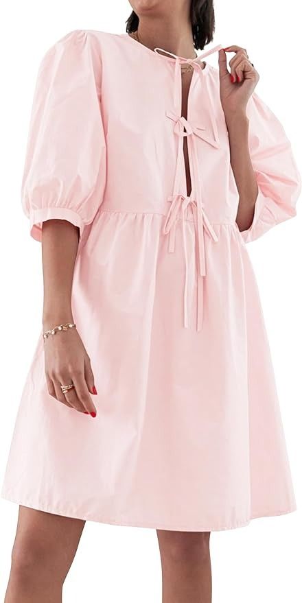 BAIGRAM Women Y2K Babydoll Peplum Dress Puff Sleeve Bow Tie Front Summer Cute Trendy Low Cut Blouse Dress Loose Fit Pink at Amazon Women’s Clothing store Pink Puff Sleeve Dress With Bow, Summer V-neck Dress With Bow Tie Back, Feminine Pink Mini Dress With Bow Tie Back, Pink V-neck Mini Dress With Tie Waist, Cut Blouse, Low Cut Blouses, Dress Puff Sleeve, Dress Loose Fit, Ruffled Button-up Cotton Mini Dress