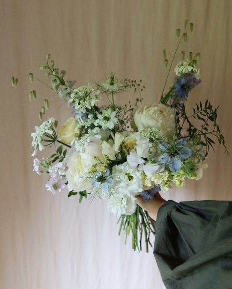 A delicate, seasonal, soft summer floral styling story for a sunny June wedding at Greentrees Estate Sussex. 🌿 With buttery yellows, soft blues, a little lilac, creams and whites on a backdrop of varied greens for the luxury bridal bouquet. by Made with Grace Floral Design- wedding and event florist creating across Surrey, Sussex, Kent Hampshire. Season inspired, wildly elegant, floral design, sustainable foam free floral mechanics. Pastel, artful, summer flowers Blue Green White Bouquet, Luxury Bridal Bouquet, Floral Mechanics, Green Wedding Flowers, Floral Styling, Waiting In The Wings, Bouquets Wedding, Blue Bouquet, Event Branding