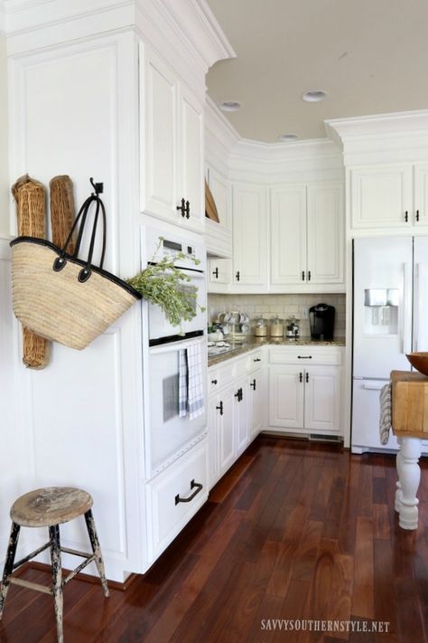 Savvy Southern Style: The Kitchen Reveal....Take Two| Santos Mahogany floor| white cabinets trimmed to ceiling White Kitchen Cherry Floors, Mahogany Floors Kitchen, Kitchen With Mahogany Floors, Cherry Floor Kitchen, Cherry Wood Floor Kitchen, Cherry Wood Floors Kitchen, Kitchen With Cherry Floors, Cherry Floors Kitchen, Mahogany Floors