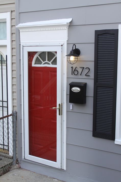 gray houses with black trim and red door | trim color behr billowy down and red doors color behr daredevil so ... Gray House Black Shutters, Mali Music, Cabin Update, Front Door Paint, Gray House Exterior, Red Front Door, Front Door Makeover, Craftsman Interior, Black Shutters