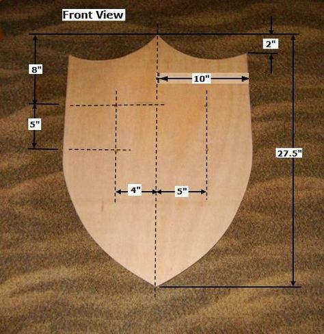 With the right plan, materials, and equipment, you can build this simple Wood Medieval Shield, as shown here. Wooden Viking Shield Diy, How To Make A Shield, Cardboard Shield, Medieval Shield, Cardboard Costume, Medieval Shields, Wooden Shield, Toy Wood, Chicken House