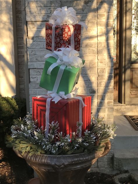 This year's presents topiary! Front Door Christmas Present Decor, Xmas Topiary Ideas, Stacked Presents Decoration, Outdoor Christmas Presents Diy, Christmas Present Topiary, Christmas Topiary Diy, Present Topiary, Diy Christmas Topiary, Outdoor Christmas Presents