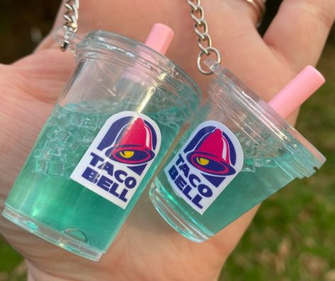 ** I am now offering these mini drinks as Christmas Ornaments as well. You can choose rather you want a keychain or ornament loop when you order.  The Baja Blast Keychain is sure to draw in compliments. The keychain features liquid on the inside that moves when shaken.   This mini drink keychain makes the perfect gift for any Taco Bell lover in your life. They are a great accessory to purses, bags, and key chains. Floating Liquid Keychain, Water Keychain, Drink Keychain, Mini Drinks, Bubble Tea Keychain, Liquid Keychain Boba, Baja Blast, Fountain Drink, Cool Keychains