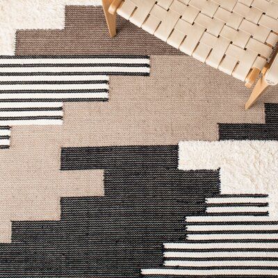 This hand woven area rug warms up your hardwood floors and delivers a rustic air to your living room. It's handmade from wool and cotton, and it pairs a geometric pattern inspired by Southwestern textiles in a palette of black, brown, and ivory hues. We love how the 0.2" pile height means it provides cushion underfoot but is still easy to vacuum. This area rug boasts a high-low pile mix to better define the pattern. Roll it out with a rug pad underneath to keep it securely in place. Rug Size: Re Southwestern Contemporary Decor, Wool Textures, Woven Area Rug, Lake Havasu, Area Rug Design, Boys Bedroom, Ivory Rug, Cotton Wool, Flat Weave Rug