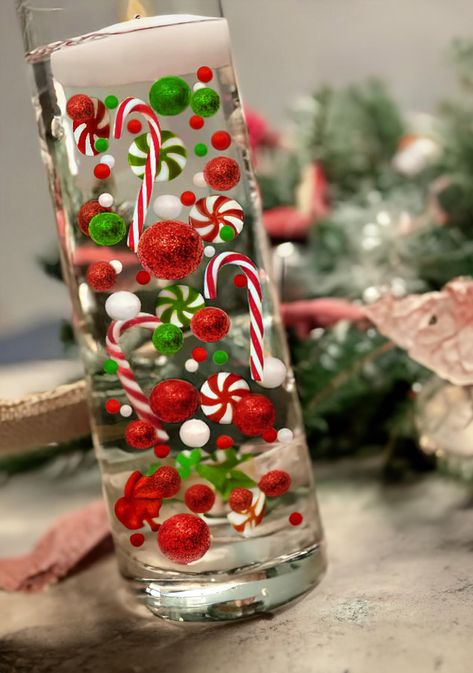 PRICES MAY VARY. Package includes: 7000 * clear water gel beads, 15 * red pearl, 15 * green pearl, 15 white peral, 7 * red acrylic Lollipops, 7 * green acrylic Lollipops 3 * red Candy Canes, 3 * green Candy Canes, These christams vase fillers are enough for you to fill at least 10 vases and create attractive floating candle centerpieces for your special day!. Note: Candles and vase are not included. Just put the water gel bead in water and absorb enough water to make it expand. The water jelly b Water Beads Centerpiece Christmas, Red And White Christmas Centerpieces, Christmas Vase Filler, Water Beads Centerpiece, Water Gel Beads, Grinchmas Party, Europe Christmas, Christmas Door Hangings, Green Candy Canes