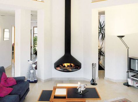 11 Hanging Fireplaces We Wouldn't Mind Cozying Up To | Hunker Focus Fireplaces, Suspended Fireplace, Hanging Fireplace, Floating Fireplace, Wall Mount Fireplace, Fireplace Designs, Wood Heater, Custom Fireplace, Wood Fireplace