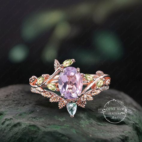 Art Deco Oval Lavender Amethyst engagement ring Bridal Set Rose Gold Unique Leaf Nature Inspired  Gemstone Promise Cluster ring jewelry Gift (Please comfirm your US size when you make an order) Jewelry details: Matal Type: 14k gold /18k gold Engagement Ring: Center Stone: Lavender Amethyst Stone Size: 6*8mm Side stones: peridot Total weight: 0.18ctw (High Quality) Wedding band Moss Agate and moissanite Carat Weight: approx. 0.182ctw Or: black sapphire (If you choose side stone in black sapphire) Lilac Engagement Ring, Lavender Sapphire Engagement Ring, Magical Rings, 18k Gold Engagement Ring, Amethyst Engagement Ring, Lavender Amethyst, Amethyst Ring Engagement, Cute Engagement Rings, Jewelry Details