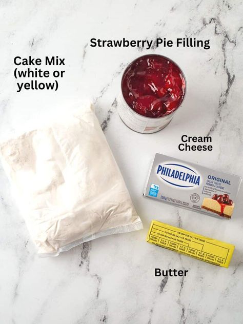 Strawberry Cream Cheese Dump Cake (4 Ingredients) | She's Not Cookin' Cream Cheese And Cake Mix Desserts, White Cake Dump Recipes, Cherry Dump Cake With Cream Cheese, Strawberry Dump Cake 3 Ingredients, Dump Cake Recipes Strawberry, Strawberry Dump Cake Recipes, Strawberry Cream Cheese Dump Cake, Raspberry Dump Cake, Strawberry Cream Cheese Dessert