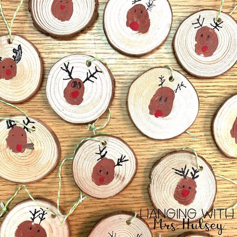 Our reindeer thumbprint ornaments turned out so cute! Here’s what we used: wood slice ornaments (Amazon), black sharpie, and red and brown… Wood Ornaments Diy Tree Slices Kids Fingerprint, Wooden Ornaments Diy Wood Slices Kids, Santa Wood Slice Ornament, Reindeer Wood Slice Ornament, Wood Slice Deer Ornaments, Preschool Christmas Gifts, Kids Christmas Crafts Easy, Lantern Christmas Decor, Christmas Diy Kids