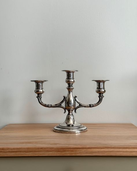 This Vintage Sterling Silver Candle Holder, made by Fisher, is a timeless piece that can bring a touch of elegance to any setting. We’ve carefully cleaned off the patina and polished it, so it now shines with a lovely luster. There are a few small dents from previous use, which give it character and a bit of history. It’s a charming piece that’s ready to be enjoyed and admired in its new home. Dimensions: Height 7” Width 9.5” #vintagesilver #sterlingsilver #fishercandleholder #antiquec... Antiqued Candle Holders, Silver Candle Holders, Silver Candle, Timeless Decor, Elegant Homes, Vintage Finds, Vintage Sterling Silver, Timeless Pieces, Vintage Silver