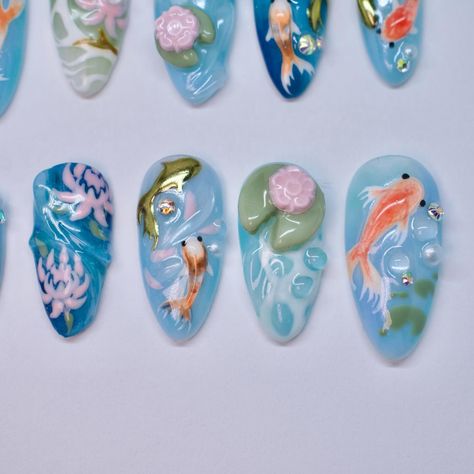 Koi fish pond ~Tier 3 custom~ Hand sculpted lily pads, hand painted koi fish & flowers, isolated chrome. Koi Nail Art, Koi Pond Nails, Austin Nails, Koi Fish Nail Art, Koi Nails, Hibiscus Flower Nail Art, Koi Fish Nails, Hibiscus Flower Nail, Feb Nails