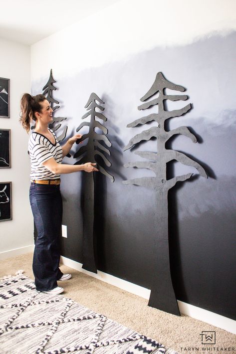 Learn how to easily create your own DIY Forest Accent Wall that will make a huge impact in your space! Cut these trees out of plywood using a jigsaw and give them a coat of paint! Full tutorial on the blog. Wood Trim Accent Wall Mountains, Forest Accent Wall, Tree Accent Wall, Diy Forest Mural, Diy Mountain Wall, Diy Forest, Modern Boys Rooms, Camp Decor, Gallery Wall Staircase