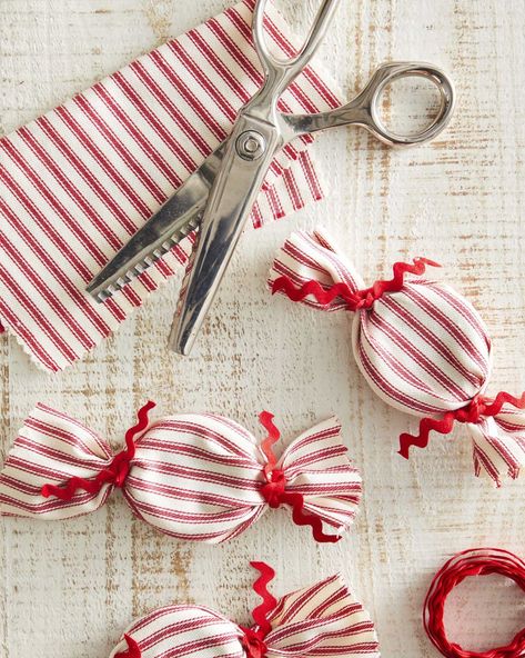 craft made from striped red and white fabric made to look like oversized peppermints Christmas Fabric Crafts, Red Christmas Ornaments, December Crafts, Easy Holidays Crafts, Peppermint Christmas, Homemade Christmas Decorations, Christmas Craft Projects, Christmas Crafts To Make, Easy Christmas Crafts