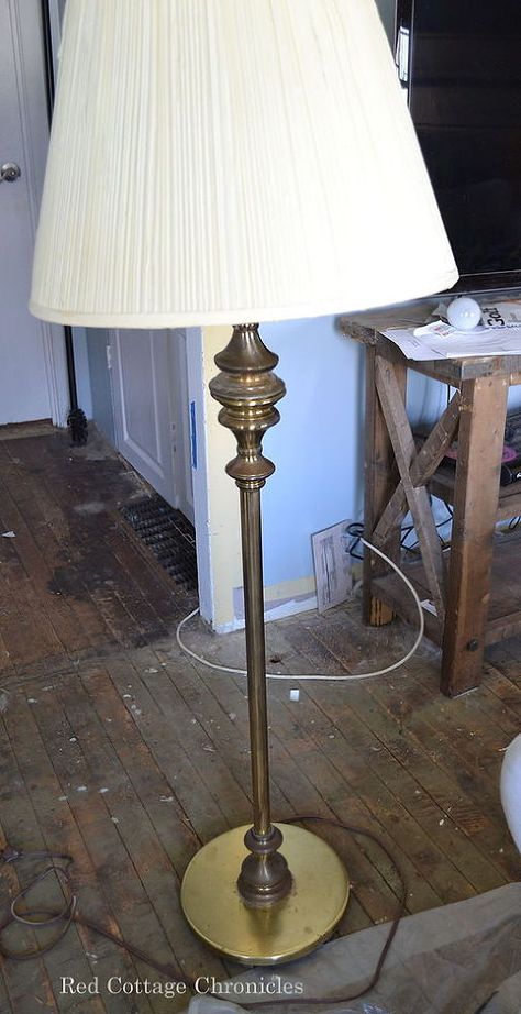 When I participated in the One Room Challenge, I was looking for a new floor lamp to tie into my casual coastal feel.  I didn't have to look too far! My Aunt was relocating from her home to a retirement apartment and she had this old brass lamp with a cream colored pleated shade.  The brass was showing its age and was dull and uninteresting. I had an old burlap shade I had actually put in the garbage pile!  I pulled it out, taped off some stripes and painted them in with some blue craft ... Floor Lamp Makeover, Lamp Redo, Diy Floor Lamp, Garden Diy Ideas, Furniture Redos, Lamp Makeover, Concrete Lamp, Pottery Barn Inspired, Floor Lamps Living Room