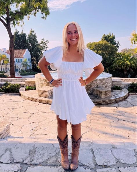 Preppy Cowboy Boots Outfits, Cowgirl White Dress Outfit, White Romper With Cowboy Boots, White Dress And Boots Country, Cowboy Boots With White Dress, Dress And Brown Cowboy Boots Outfit, Country White Dress With Boots, White Sundress Cowboy Boots, White Dress Black Cowboy Boots