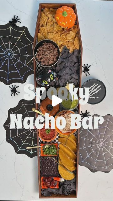 Shahla Sandoval on Instagram: "My favorite Halloween hack was turning this coffin-shaped sign into my personal nacho bar / charcuterie board / movie night board a few years back. You can leave it unfinished or stain it with coffee like I did. It’s not food safe so I always use parchment paper. The Halloween Nacho Bar is a crowd favorite and perfect for your Halloween parties or if you want to feed a crowd before trick or treating.  I bought my untouched coffin sign a few years back and they’ve since changed it a bit. I’ve linked it and all the details on my blog. Comment nacho and you’ll be send the blogpost. #halloweendecor #halloweenpartyideas #halloweenpartyfood #halloweenparty" Charcuterie Board Movie Night, Halloween Nacho Bar, Bar Charcuterie Board, Movie Night Board, Coffin Sign, Chili Bar Party, Nacho Party, Taco Bar Party, Chili Bar