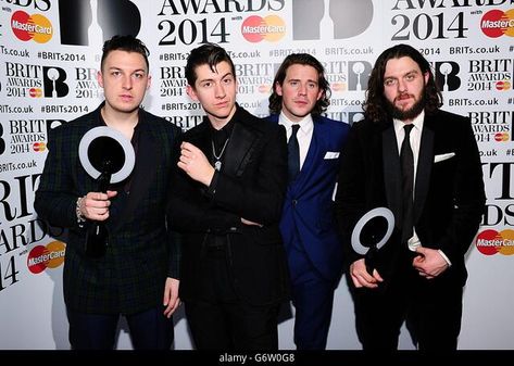 (L-R) Matt Helders, Alex Turner Jamie Cook and Nick O'Malley from Arctic Monkeys with their awards in the press room at the 2014 Brit Awards at the O2 Arena, London. Stock Photo Jamie Cook, O2 Arena London, Firefly Music Festival, Matt Helders, Monkeys Band, Back Vocal, O2 Arena, Artic Monkeys, Brit Awards