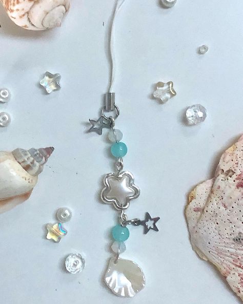 new design up now 🐚🌊 (link in bio😼) - - - - #sea #seashell #starfish #siren #sirencore #ocean #oceancore #seacore #pearljewelry #beadedkeychain #aestheticphonecharm #beadedjewelry #phonecharm #mermaidaesthetic #silverjewelry #pearl #staraesthetic #beach #summerjewelry Ocean Clothes, Mermaidcore Aesthetic, Sea Core, Cord Keychain, Beads Lanyard, Beach Keychain, Phone Keychain, Keychain Blue, Jewels Diy