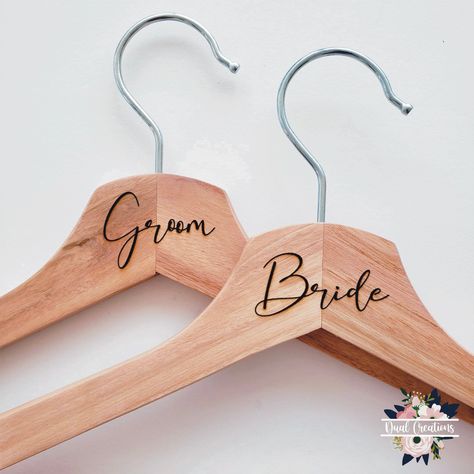 "BRIDE AND GROOM HANGERS. Listing is for a pair of hangers with Bride and groom engraved as show. if you need them personalized with the names of the wedding couple please click to the following link. Natural Wooden Wedding hanger, perfect keepsake for any wedding Hanger Specifications: Natural Wood 17\" Wide 7/16\" Thick Engrave with laser printer. this item takes up to 5 days to have it ready. I accept returns for this item but customers are responsible for shipping and return shipping refund Bride Coat Hanger, Coat Hanger Diy, Groom Hanger, Engraved Hangers, Wooden Coat Hanger, Hanger Wedding, Bridal Shower Gifts For Bride, Wooden Coat Hangers, Wedding Accesories