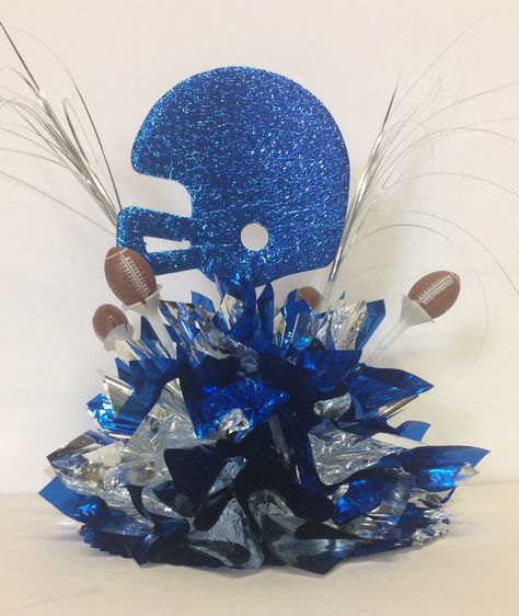 Football Helmet Centerpieces, Dallas Cowboys Centerpieces Ideas, Football Centerpieces Diy, Helmet Centerpiece, Football Centerpiece Ideas, Football Party Centerpieces, Track Banquet, Sports Themed Centerpieces, Football Banquet Centerpieces