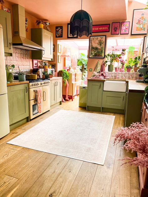 Pink and green. Kitchen. Maximalist interiors. Quirky. Eclectic home. Green Kitchen Cabinets Pink Walls, Subtle Pink Accents, Green Cabinets Pink Walls, Pink Yellow White Green Bedroom, Cottagecore Pink Kitchen, Pink Green And Black Kitchen, 70s Pink Kitchen, Blush Kitchen Walls, Green And Coral Kitchen