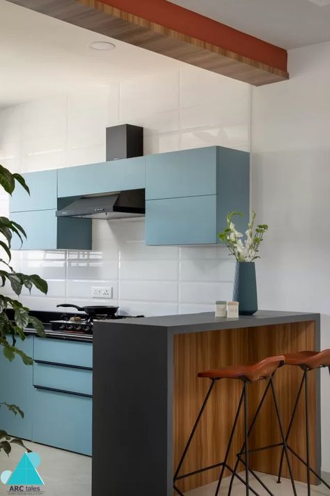 A Bit Of California Vibe To Nashik's "MH15 Jones" With A Modern Design | ARC Tales - The Architects Diary Indian Contemporary Kitchen Designs, Kitchen Post, California Vibe, Sleek Kitchen, California Living, Kitchen Color, Natural Ventilation, Kitchen Cabinet Colors, Blue Kitchens