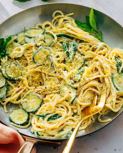 This zucchini pasta recipe is lusciously creamy, flavored with Parmesan and Pecorino cheese, basil and lemon zest. A tasty simple dinner! #zucchini #zucchinipasta #zucchinipastarecipe #easypasta #summerpasta #summerrecipe #summer dinner Zucchini In Pasta Recipes, Zucchini Lemon Pasta Recipes, Lemon Ricotta Zucchini Pasta, Lemon Butter Zucchini Pasta, Zucchini Pesto Pasta Recipes, Zucchini Garlic Pasta, Spaghetti And Zucchini, Zucchini Lemon Alfredo, One Pot Zucchini Basil Pasta