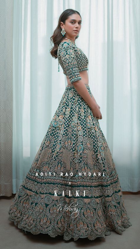 #KALKIxAditiRaoHydari About the outfit:The emerald green showstopper lehenga showcases varying levels of jaw-dropping jaal exposure with increased coverage of intricate hand-done butti work. And while elaborate gold embellishments and opulent cutwork hem details made a strong showing on the runway, minimalist pastel floral motifs and classic hand stitched blouse presented a bridal counterpoint. Emerald Green Lehenga, Aditi Rao Hydari, Aditi Rao, Desi Wedding Dresses, Indian Outfits Lehenga, Wedding Lehenga Designs, Lehnga Dress, Bridal Lehenga Collection, Designer Bridal Lehenga